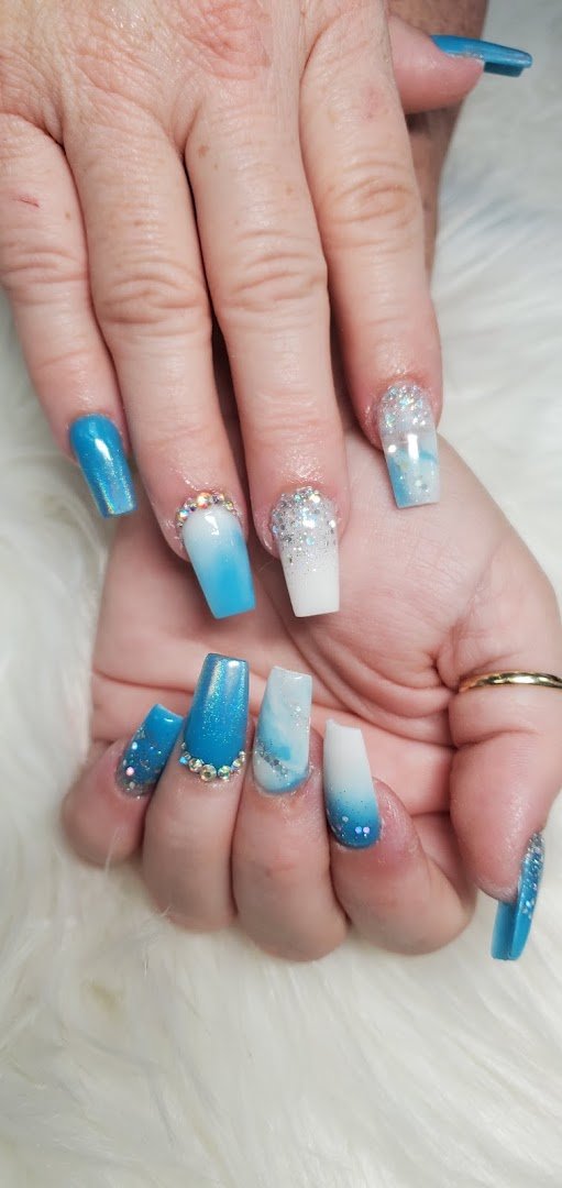 Close-up of gel polish bottles beside manicure tools.